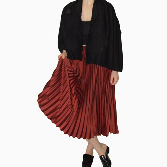 PLEATED ORANGE SKIRT